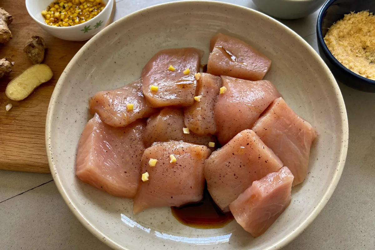Bite-size chicken breast pieces tossed with soy sauce and cornstarch for stir fry