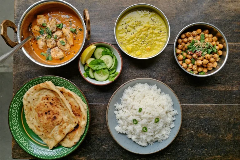 Quick Indian dinner recipes spread with chicken tikka masala, dal, chana masala, basmati rice, naan and raita